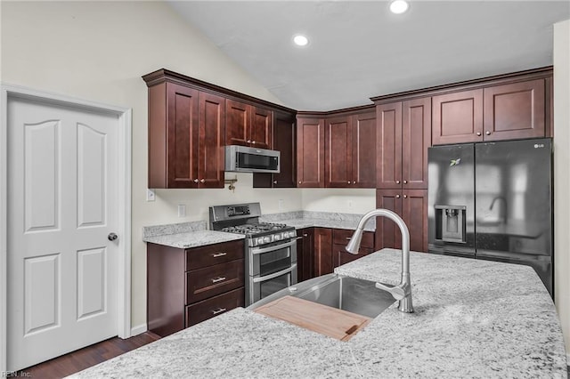 2416 Broadnax Cir, Chesapeake, VA 23323 - kitchen with appliances with stainless steel finishes, dark wood-style flooring, recessed lighting, lofted ceiling, and light stone counters
