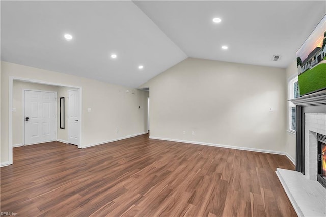 2416 Broadnax Cir, Chesapeake, VA 23323 - unfurnished living room featuring a fireplace, wood finished floors, vaulted ceiling, and recessed lighting