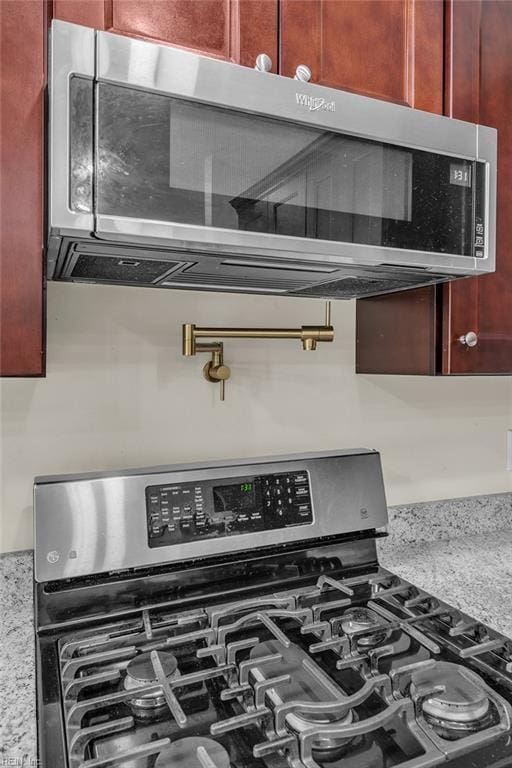 2416 Broadnax Cir, Chesapeake, VA 23323 - kitchen view of stainless steel appliances, pot filler, reddish brown cabinets, and light stone countertops