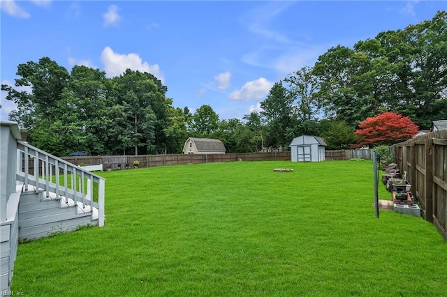 2416 Broadnax Cir, Chesapeake, VA 23323 - fenced backyard with a storage unit