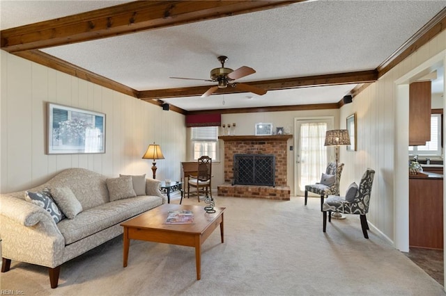 2513 Torrey Pl, Virginia Beach, VA 23454 - living room with beam ceiling, crown molding, ceiling fan, light carpet, and a brick fireplace