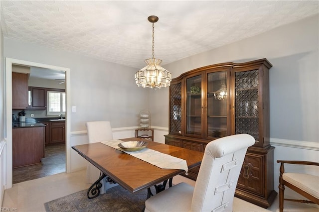 2513 Torrey Pl, Virginia Beach, VA 23454 - dining space with a chandelier and a wainscoted wall