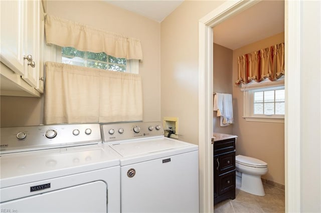 2513 Torrey Pl, Virginia Beach, VA 23454 - laundry area with washer and dryer, light tile patterned floors, and cabinet space