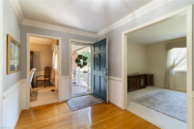 2513 Torrey Pl, Virginia Beach, VA 23454 - foyer entrance with light wood-type flooring, a wainscoted wall, and crown molding