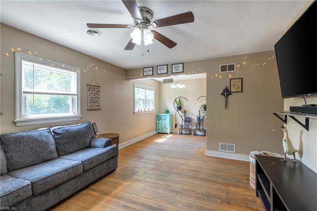 1370 Boxwood Cir, Norfolk, VA 23518 - living area featuring a ceiling fan, wood finished floors, and a chandelier