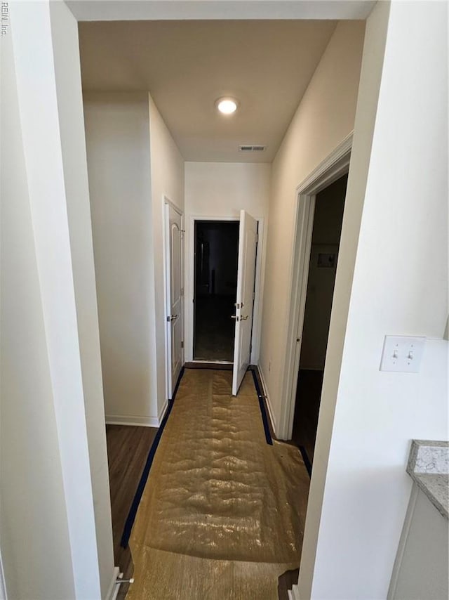 208 St Pauls Ave Unit 30-3, Smithfield, VA 23430 - hallway with baseboards and wood finished floors