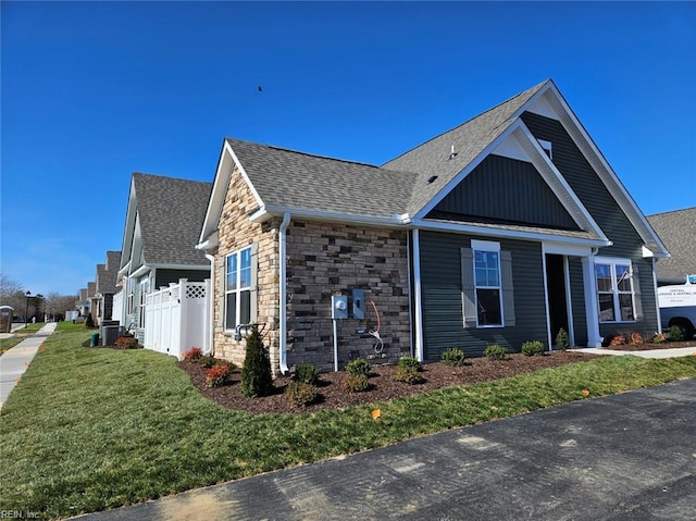 208 St Pauls Ave Unit 30-3, Smithfield, VA 23430 - view of side of property with board and batten siding, a shingled roof, and stone siding