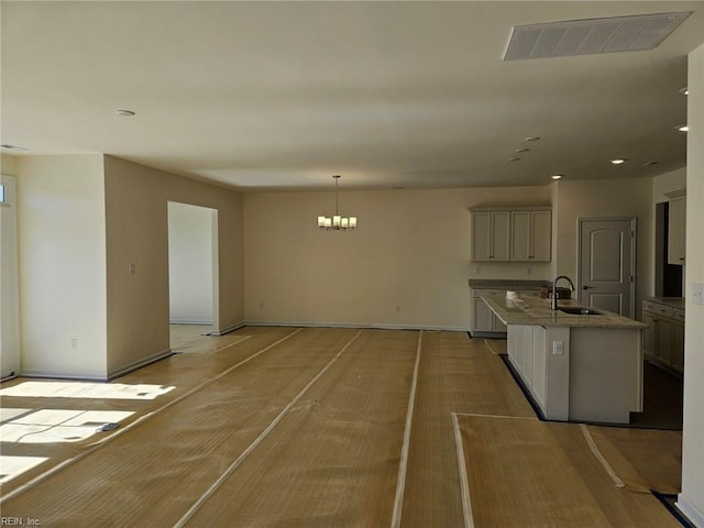 208 St Pauls Ave Unit 30-3, Smithfield, VA 23430 - kitchen with a chandelier, an island with sink, stone counters, recessed lighting, and hanging light fixtures