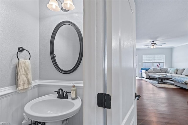 7546 Villa Ct Unit 37, Gloucester Point, VA 23062 - bathroom with wood finished floors, ceiling fan, and wainscoting