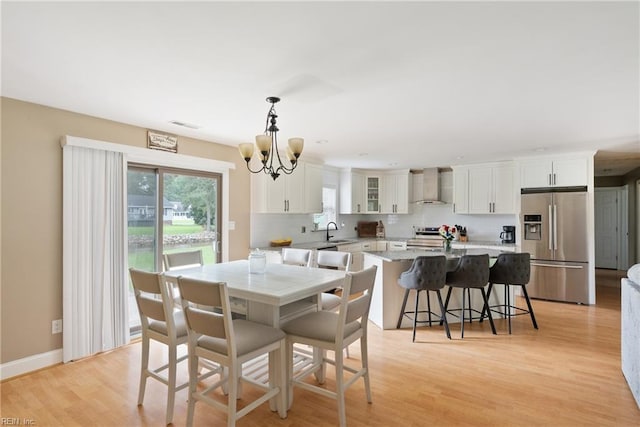 6019 Tabiatha Ln, Lanexa, VA 23089 - dining space featuring a chandelier and light wood finished floors