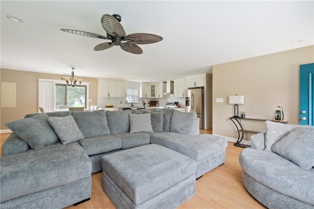 6019 Tabiatha Ln, Lanexa, VA 23089 - living area with a chandelier, ceiling fan, and light wood finished floors