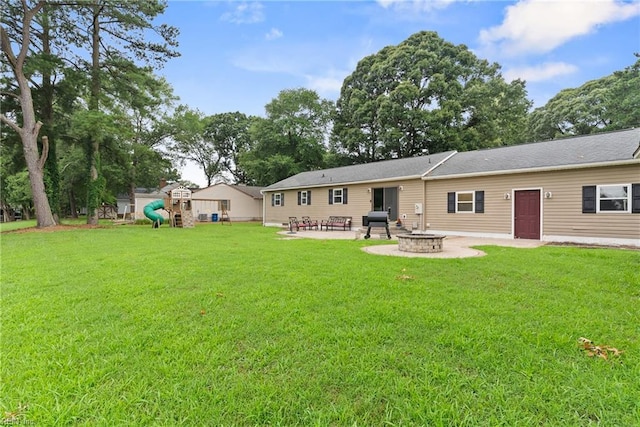6019 Tabiatha Ln, Lanexa, VA 23089 - back of house featuring a playground, a patio area, an outdoor fire pit, and a lawn