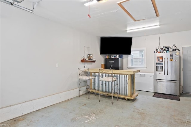 6019 Tabiatha Ln, Lanexa, VA 23089 - garage with stainless steel fridge with ice dispenser