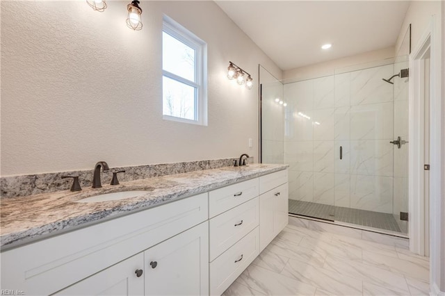 120 Rowland Creek Rd, Moyock, NC 27958 - bathroom featuring a stall shower, marble finish flooring, double vanity, and recessed lighting