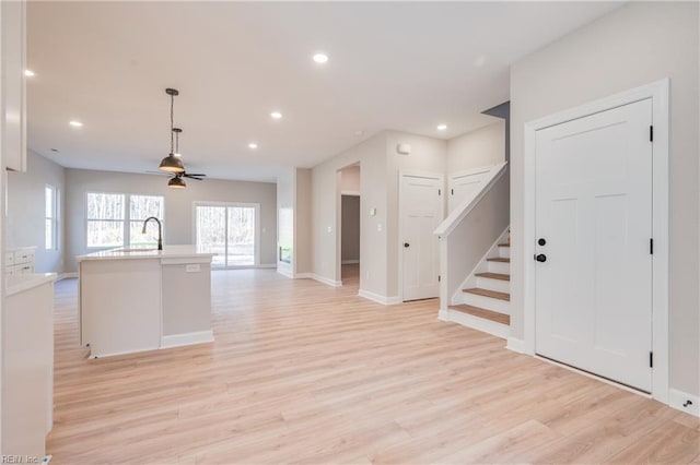 120 Rowland Creek Rd, Moyock, NC 27958 - kitchen featuring open floor plan, light wood finished floors, light countertops, recessed lighting, and a kitchen island with sink