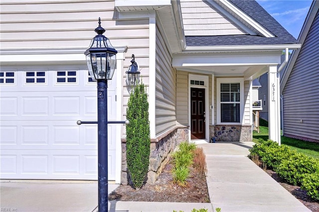 6371 Yarmouth Run, Williamsburg, VA 23188 - view of exterior entry featuring a shingled roof, stone siding, and a porch
