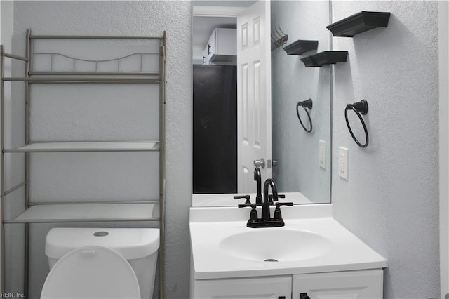 126 Ridge Rd, Poquoson, VA 23662 - half bathroom featuring vanity and a textured wall