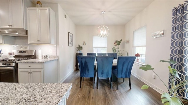 9809 Coral Bells Ct, Toano, VA 23168 - dining space featuring wood finished floors and a chandelier