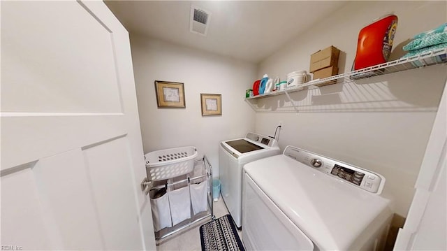 9809 Coral Bells Ct, Toano, VA 23168 - washroom with washer and clothes dryer