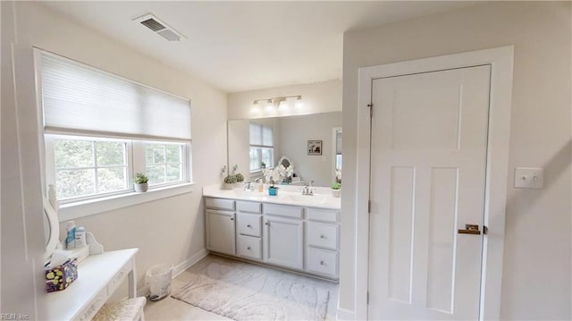 9809 Coral Bells Ct, Toano, VA 23168 - bathroom featuring double vanity and marble finish floors