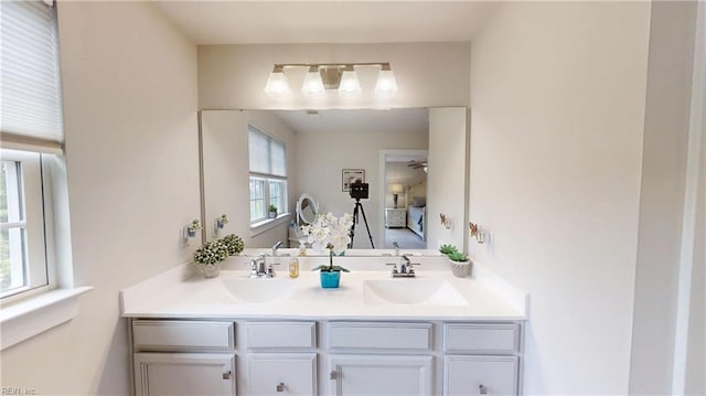 9809 Coral Bells Ct, Toano, VA 23168 - bathroom featuring double vanity, a ceiling fan, and connected bathroom