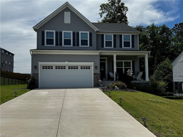 9809 Coral Bells Ct, Toano, VA 23168 - view of front of house featuring driveway, an attached garage, a porch, and stone siding