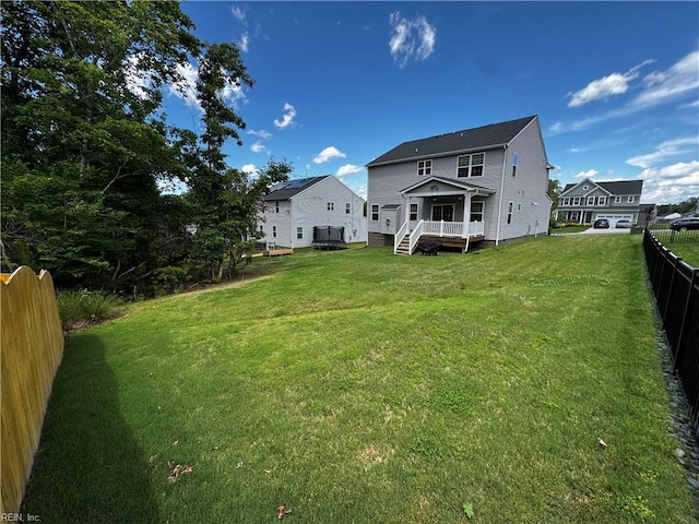 9809 Coral Bells Ct, Toano, VA 23168 - rear view of house featuring a fenced backyard and a wooden deck