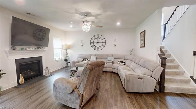 9809 Coral Bells Ct, Toano, VA 23168 - living area featuring stairway, a ceiling fan, wood finished floors, recessed lighting, and a glass covered fireplace