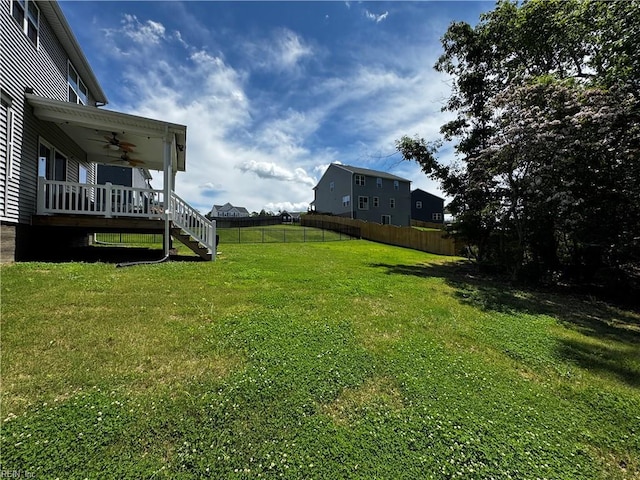 9809 Coral Bells Ct, Toano, VA 23168 - view of yard featuring a ceiling fan, a wooden deck, and stairway