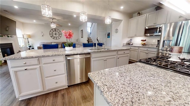 9809 Coral Bells Ct, Toano, VA 23168 - kitchen with stainless steel appliances, open floor plan, a ceiling fan, dark wood-type flooring, and white cabinets
