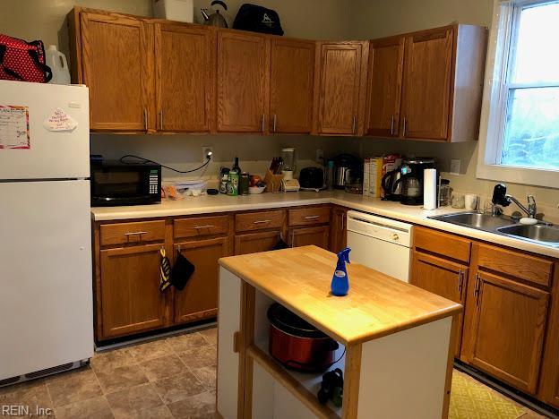 5110 Salem St, Richmond, VA 23231 - kitchen with white appliances, healthy amount of natural light, brown cabinetry, and wood counters