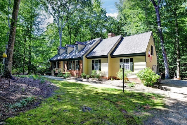 102 Whitehall Ct, Williamsburg, VA 23188 - view of front of property with a porch, a chimney, and a front lawn