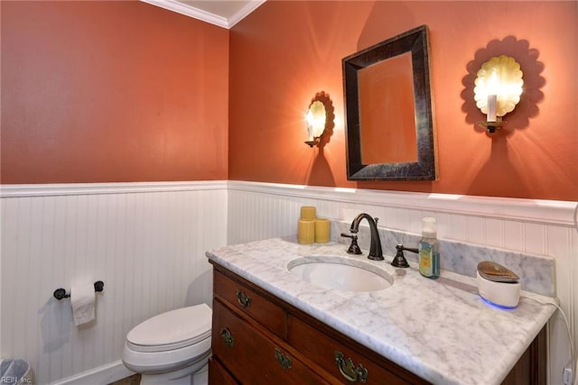 102 Whitehall Ct, Williamsburg, VA 23188 - bathroom featuring vanity, a wainscoted wall, and ornamental molding