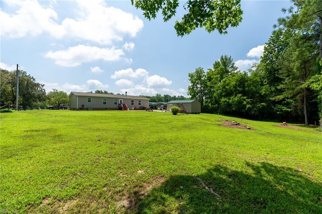 2501 Clancie Rd, Shacklefords, VA 23156 - view of green lawn with an outbuilding