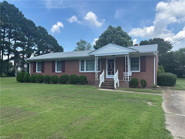 906 Rebecca St, Franklin, VA 23851 - ranch-style home featuring a front lawn, brick siding, and a porch