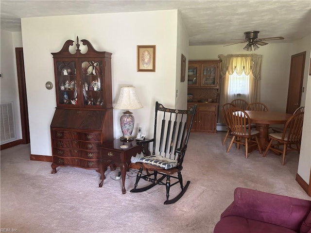 906 Rebecca St, Franklin, VA 23851 - carpeted dining area with a ceiling fan and baseboard heating