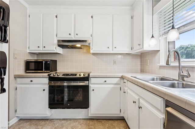 2855 Cypress Crest Ln, Hayes, VA 23072 - kitchen with stainless steel appliances, ventilation hood, white cabinets, and tile counters