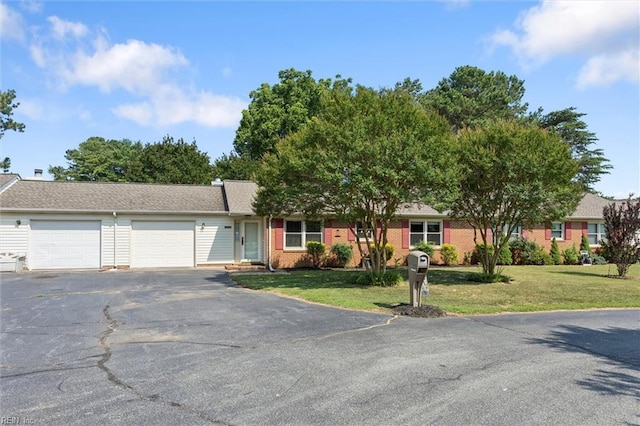 2855 Cypress Crest Ln, Hayes, VA 23072 - ranch-style home featuring an attached garage, driveway, a front yard, and brick siding