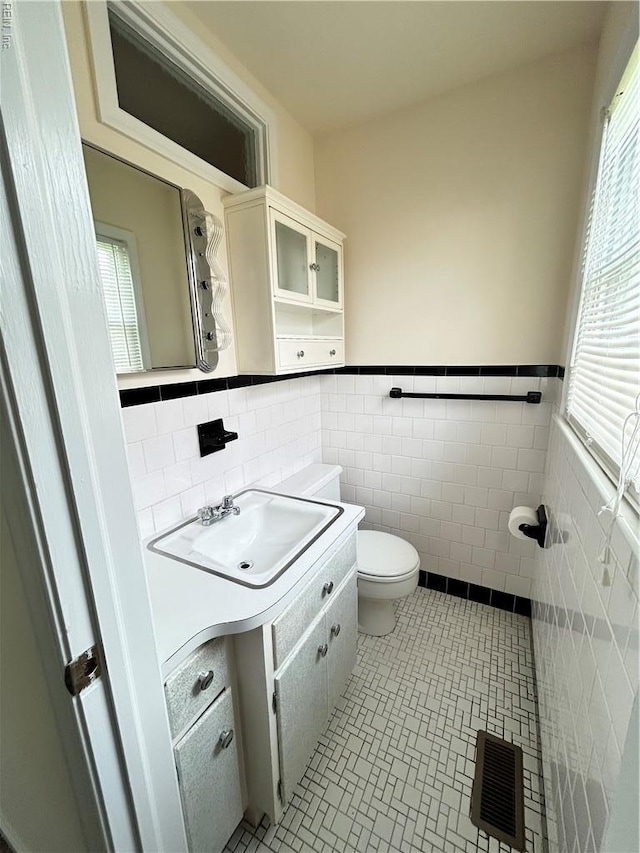 1813 Lake View Dr, Hampton, VA 23666 - bathroom with tile walls, tile patterned flooring, wainscoting, and vanity