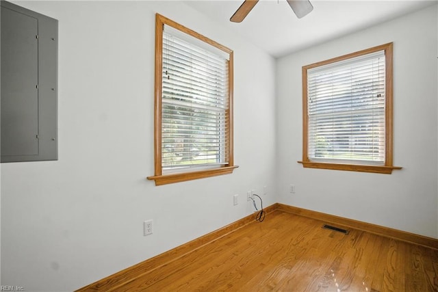 6 Albemarle St, Portsmouth, VA 23707 - unfurnished room featuring electric panel, wood finished floors, and ceiling fan