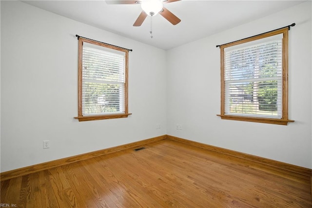 6 Albemarle St, Portsmouth, VA 23707 - unfurnished room featuring plenty of natural light, wood finished floors, and a ceiling fan