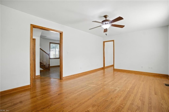 6 Albemarle St, Portsmouth, VA 23707 - empty room featuring a ceiling fan, light wood finished floors, and stairs