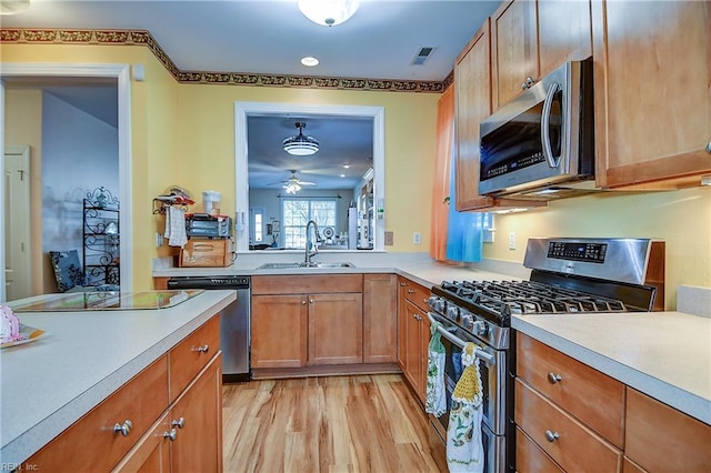 1132 Broadholme Pl Unit 642, Virginia Beach, VA 23455 - kitchen featuring stainless steel appliances, ceiling fan, light countertops, light wood-style flooring, and recessed lighting