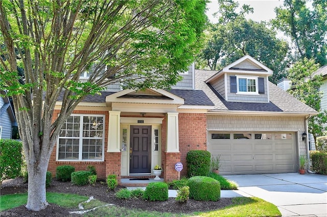 1132 Broadholme Pl Unit 642, Virginia Beach, VA 23455 - view of front facade featuring concrete driveway, roof with shingles, brick siding, and a garage