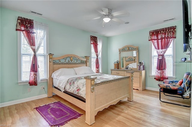 1132 Broadholme Pl Unit 642, Virginia Beach, VA 23455 - bedroom featuring light wood-style floors, multiple windows, and ceiling fan