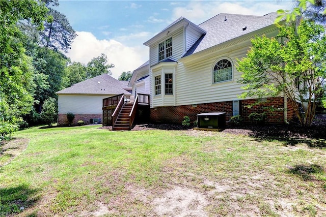 112 Sandy Point Rdg, Williamsburg, VA 23188 - rear view of house featuring stairway, a yard, and a wooden deck