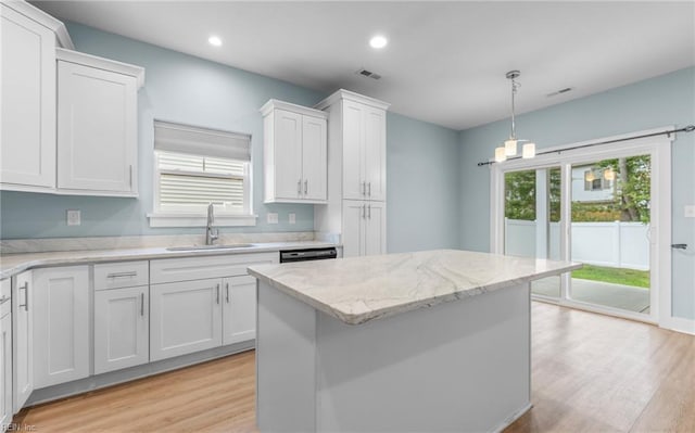 1608 Carma Ct, Virginia Beach, VA 23454 - kitchen featuring light wood finished floors, white cabinetry, hanging light fixtures, recessed lighting, and light stone counters