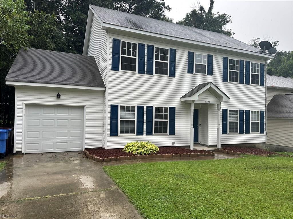 5029 John St, Chesapeake, VA 23321 - colonial inspired home featuring an attached garage, driveway, and a front lawn