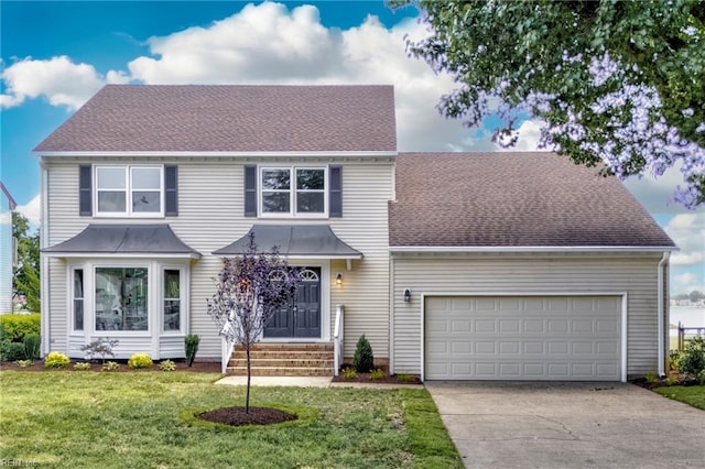 1545 Lake James Dr, Virginia Beach, VA 23464 - view of front of home featuring driveway, a garage, a front yard, and a shingled roof
