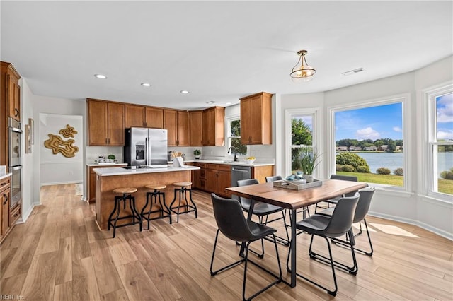 1545 Lake James Dr, Virginia Beach, VA 23464 - dining room with recessed lighting, light wood-type flooring, and a water view